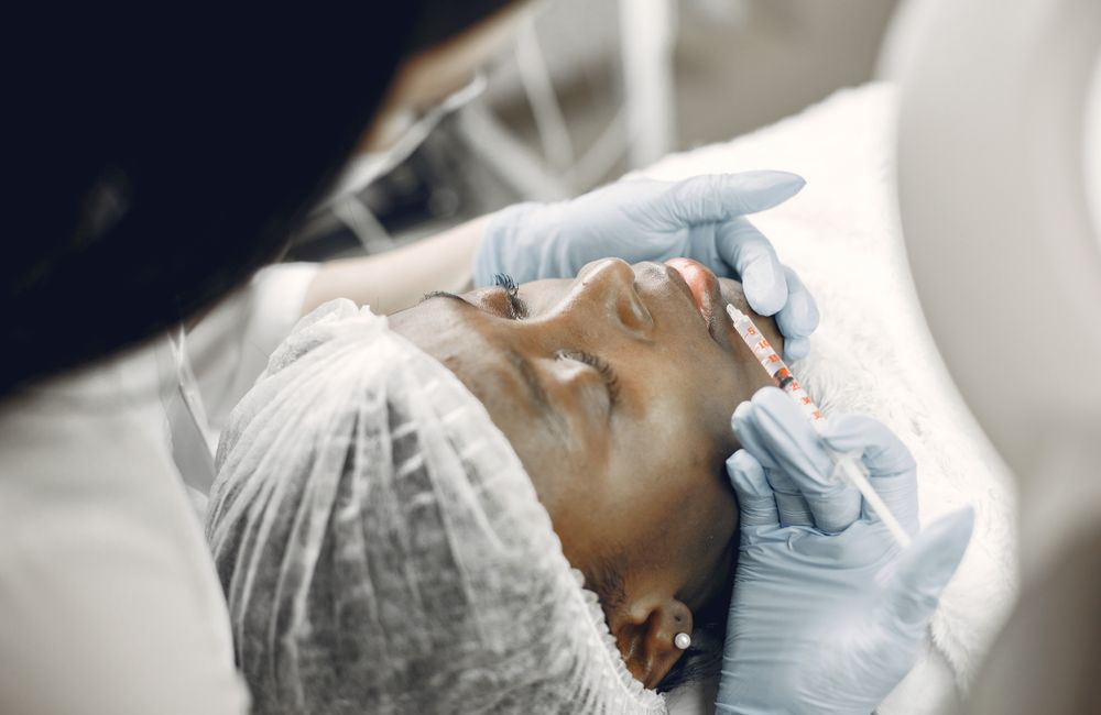Stock photograph: Cosmetic lip filler injection procedure; not Valeon staff, patients, or results