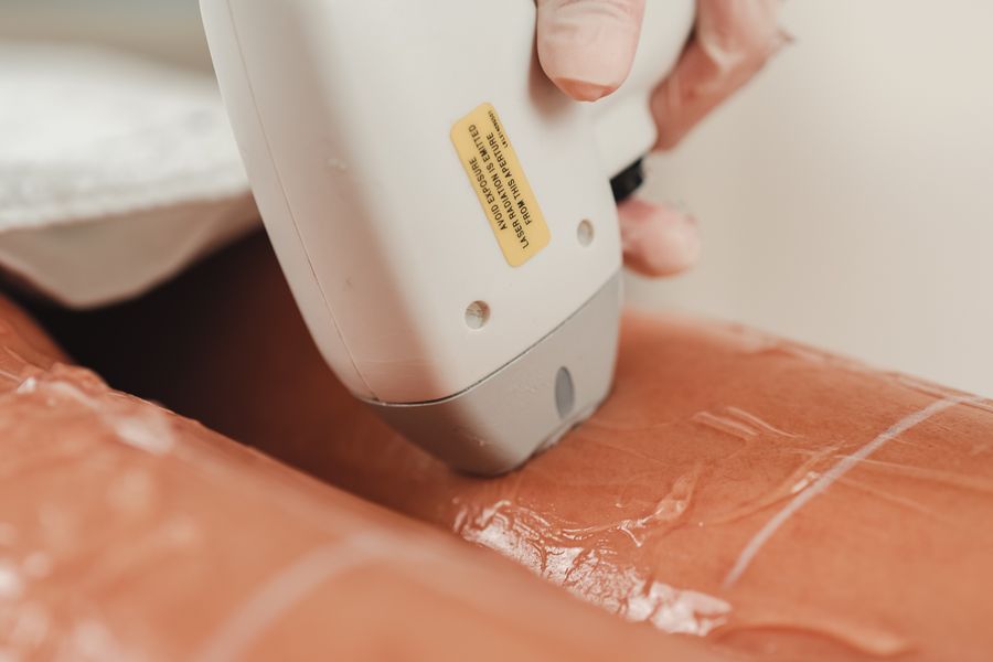 Illustrative laser hair-care equipment photograph; not a Valeon patient, procedure, or result