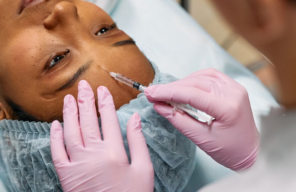 Stock photograph: Forehead cosmetic injection procedure; not Valeon staff, patients, or results